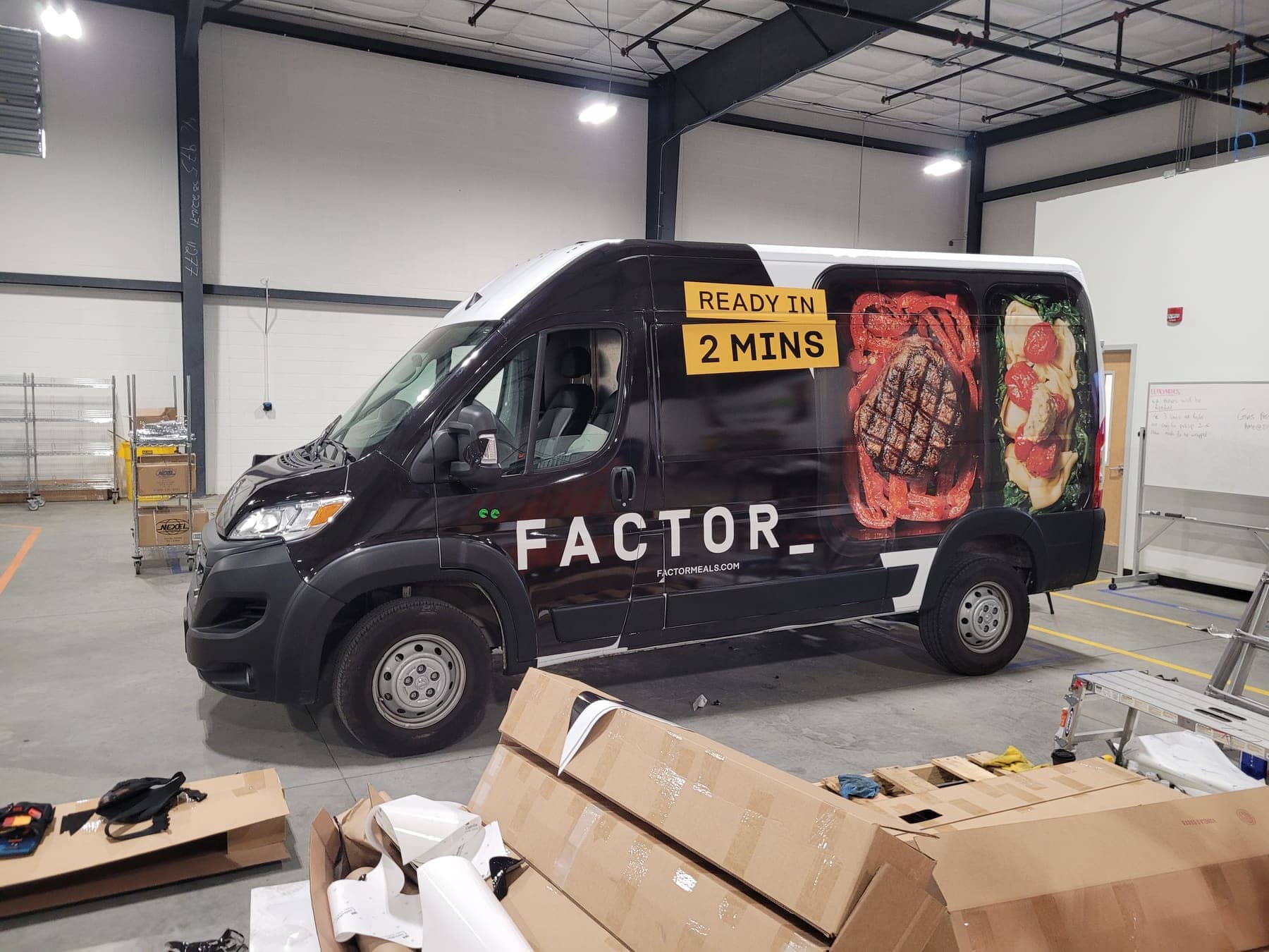 Black Ram ProMaster with steak-dinner graphics and Ready in 2 Mins panel, mid-install