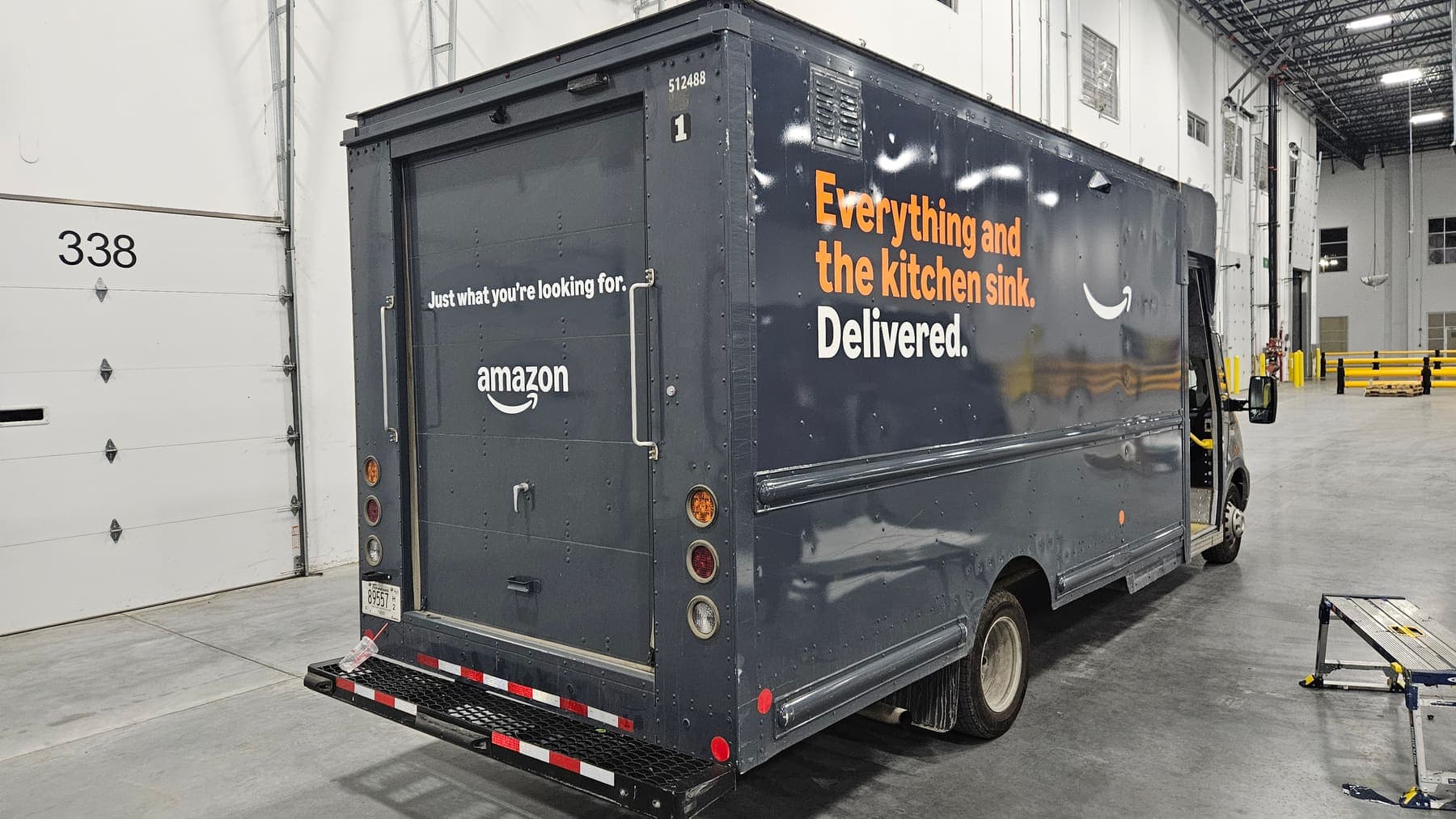 Amazon step van with fleet graphics parked at a loading dock