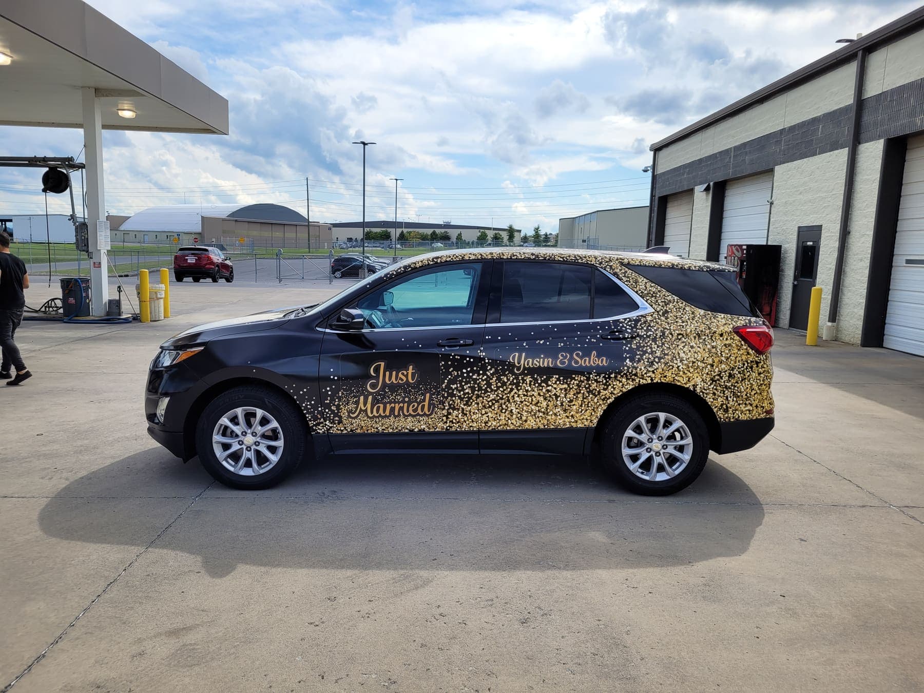 Chevy Equinox in a gold glitter wrap with Just Married script for a wedding weekend