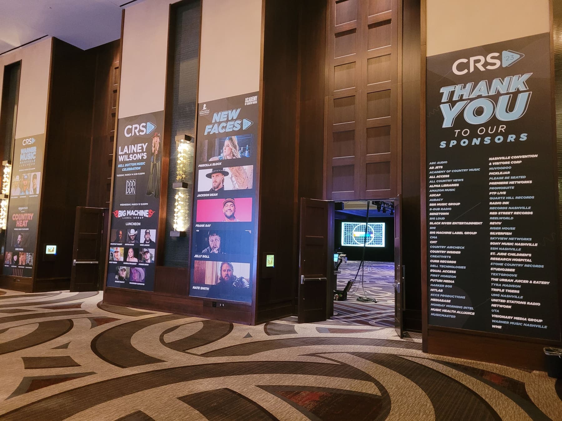 Tall column banners for the CRS conference in a hotel ballroom foyer