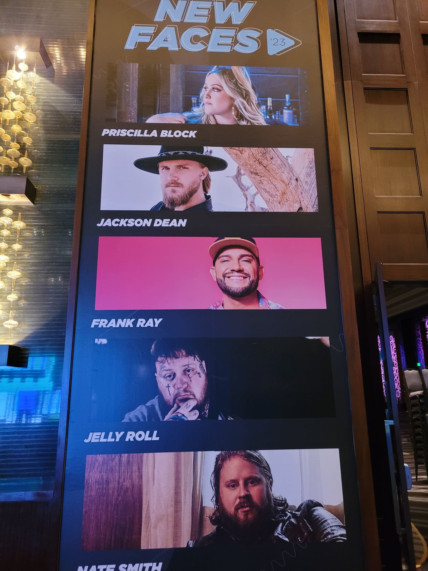 Large digital-style banner wall showing the CRS New Faces country artist lineup