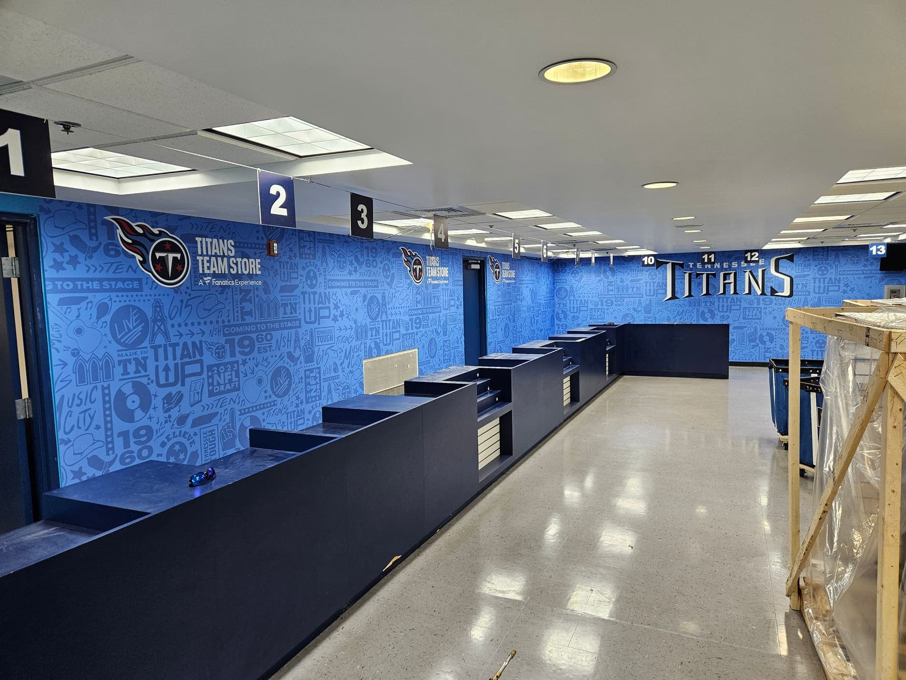 Tennessee Titans team store interior with navy illustrated wall graphics